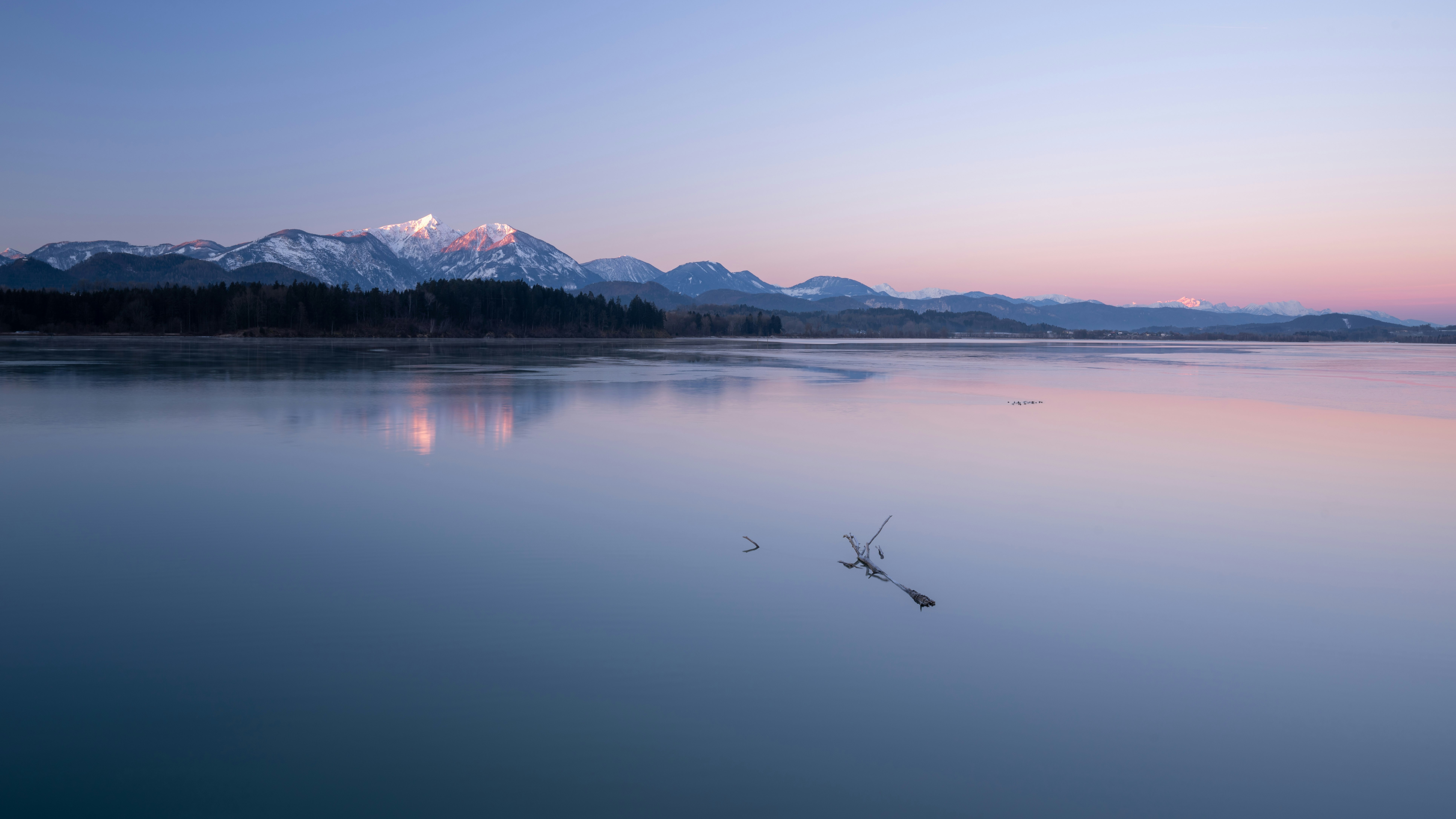 lake and mountains during day time